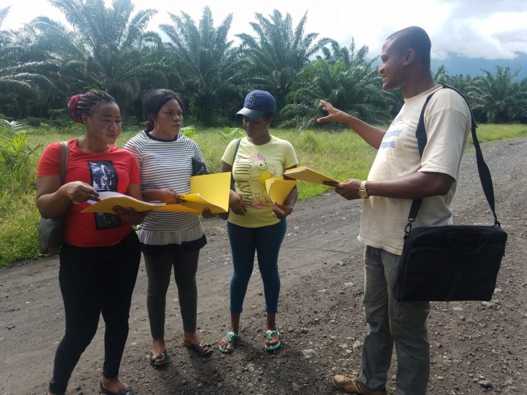 The Director of IYEC with other staff for a field work at the west coast of Limbe (Idenau). Assigning  staff to the different communities for the PBF health care project to carry monitoring and evaluation of hospital and health centre’s in the Limbe health area.